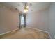 Carpeted bedroom featuring a ceiling fan, large window with curtains, and neutral paint color at 1529 Wellesley Cir, Mount Pleasant, SC 29466
