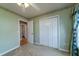 Neutral bedroom featuring plush carpeting, a ceiling fan, and a double-door closet for optimal storage at 1529 Wellesley Cir, Mount Pleasant, SC 29466