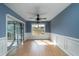 Bright dining room with blue walls, white trim, wood floors, and sliding door to outdoor porch at 1529 Wellesley Cir, Mount Pleasant, SC 29466