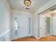 Welcoming entryway with hardwood floors, paneled walls, and a view of the front door at 1529 Wellesley Cir, Mount Pleasant, SC 29466