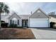 Inviting single-story home with a neat front lawn, attached garage, and classic architectural details at 1529 Wellesley Cir, Mount Pleasant, SC 29466