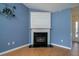 Cozy fireplace with black marble hearth and white mantle, perfect for relaxing evenings at 1529 Wellesley Cir, Mount Pleasant, SC 29466