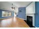 Spacious living room with hardwood floors, fireplace, and large windows offering plenty of natural light at 1529 Wellesley Cir, Mount Pleasant, SC 29466