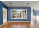 Bright living room with large windows overlooking the outdoor space, providing ample natural light at 1529 Wellesley Cir, Mount Pleasant, SC 29466