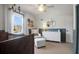 Bedroom with natural light, a comfortable chair, crib, and dresser, all arranged in a cozy space at 1656 Lauda Dr, Mount Pleasant, SC 29464