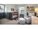 Bedroom with dark wood crib, natural light, a reading chair, and built-in shelves for books and toys at 1656 Lauda Dr, Mount Pleasant, SC 29464