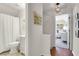 Hallway view leading to a bathroom with shower and a Bedroom with natural light and cheerful decor at 1656 Lauda Dr, Mount Pleasant, SC 29464