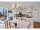 Well-lit kitchen and dining area with stainless appliances and sliding doors to the backyard at 1656 Lauda Dr, Mount Pleasant, SC 29464