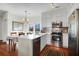 Bright kitchen with stainless steel appliances, modern cabinetry, and dining area with sliding glass doors at 1656 Lauda Dr, Mount Pleasant, SC 29464