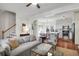 Open concept living space with a view of the staircase, dining area, and well-lit kitchen at 1656 Lauda Dr, Mount Pleasant, SC 29464