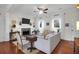 Inviting living room features hardwood floors, fireplace, ceiling fan, and natural lighting at 1656 Lauda Dr, Mount Pleasant, SC 29464
