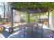 Backyard covered patio featuring a dining table and chairs, perfect for outdoor gatherings and relaxation at 1656 Lauda Dr, Mount Pleasant, SC 29464