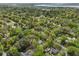 An aerial view showcases this home within a wooded, established neighborhood at 1744 Pinckney Park Dr, Charleston, SC 29407