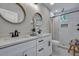 Modern bathroom featuring dual sinks, updated fixtures, and sleek glass-enclosed shower at 1744 Pinckney Park Dr, Charleston, SC 29407