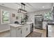 Bright kitchen island with modern lighting, seating, stainless appliances, and ample storage at 1744 Pinckney Park Dr, Charleston, SC 29407