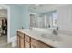 Bright bathroom featuring double vanity, large mirror, and a glimpse of a walk-in shower at 1878 Carolina Bay Dr, Charleston, SC 29414