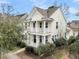 Charming two-story home with double porches and manicured landscaping creating a welcoming curb appeal at 1878 Carolina Bay Dr, Charleston, SC 29414
