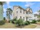 Beautiful two-story home with a welcoming porch and well-maintained lawn at 1878 Carolina Bay Dr, Charleston, SC 29414