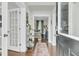 Welcoming foyer with hardwood floors, a decorative rug, and a view into the living area at 1878 Carolina Bay Dr, Charleston, SC 29414