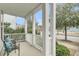 Cozy front porch featuring white railings and comfortable seating area, inviting relaxation at 1878 Carolina Bay Dr, Charleston, SC 29414