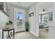 Bright hallway featuring a view of a bedroom and a door leading to a deck at 1878 Carolina Bay Dr, Charleston, SC 29414