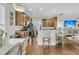 Well-lit kitchen with stainless steel appliances, bar seating, and hardwood floors at 1878 Carolina Bay Dr, Charleston, SC 29414
