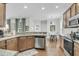 Functional kitchen featuring granite countertops, stainless steel appliances, and hardwood floors at 1878 Carolina Bay Dr, Charleston, SC 29414