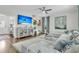 Inviting living room with a large sectional sofa, TV, and stylish decor, perfect for relaxing at 1878 Carolina Bay Dr, Charleston, SC 29414