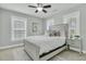 Comfortable bedroom with neutral walls, ceiling fan, and bright windows at 1878 Carolina Bay Dr, Charleston, SC 29414