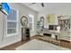 Bright office space with hardwood floors, built-in bookshelves, and a neutral rug at 1878 Carolina Bay Dr, Charleston, SC 29414