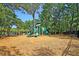 Community playground with modern play equipment, green design, and plenty of space for children to play at 1878 Carolina Bay Dr, Charleston, SC 29414