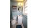 Cozy bathroom featuring a sink, toilet, and storage shelf at 1902 Morgan Ave, North Charleston, SC 29406