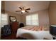 Bedroom featuring a window, ceiling fan, and warm, neutral tones at 1902 Morgan Ave, North Charleston, SC 29406