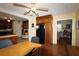 Kitchen and dining area with wood floors and black refrigerator at 1902 Morgan Ave, North Charleston, SC 29406