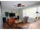 Comfortable living room with a ceiling fan, natural light, and modern furnishings at 1902 Morgan Ave, North Charleston, SC 29406
