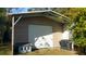 New utility shed with roll up door, offering storage and covered space at 1902 Morgan Ave, North Charleston, SC 29406
