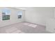 This bright bedroom features neutral carpet, two windows, and neutral walls providing a blank canvas for your personal touch at 192 Lyra Ln, Summerville, SC 29486