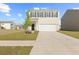 Charming two-story home with a manicured lawn and a two-car garage at 192 Lyra Ln, Summerville, SC 29486
