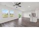 Open-concept living area with modern flooring, ceiling fan, and natural light at 192 Lyra Ln, Summerville, SC 29486