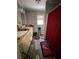 View of the bathroom with double sinks and a red shower curtain at 197 Melrose Pl, Moncks Corner, SC 29461