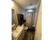 View of the bathroom with sink, toilet, shower with colorful shower curtain at 197 Melrose Pl, Moncks Corner, SC 29461