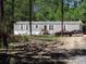 Single-Gathering home with a rustic exterior, featuring ample outdoor space and mature trees at 197 Melrose Pl, Moncks Corner, SC 29461