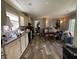 View of the kitchen with hardwood floors, appliances, and an eat-in dining area at 197 Melrose Pl, Moncks Corner, SC 29461