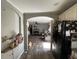 View from the kitchen to the living room with hardwood floors and archway at 197 Melrose Pl, Moncks Corner, SC 29461