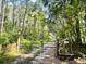 Gated entrance to a wooded property, hinting at privacy and a nature-filled setting at 197 Melrose Pl, Moncks Corner, SC 29461