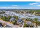 Breathtaking aerial view of waterfront homes with private docks surrounded by lush greenery and tranquil waterways at 2040 Ashburton Way, Mount Pleasant, SC 29466