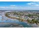 Aerial view of a waterfront community showing waterfront houses and boats docked along the shore at 2040 Ashburton Way, Mount Pleasant, SC 29466