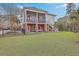 Expansive backyard with screened porch, lush lawn, and mature trees at 2040 Ashburton Way, Mount Pleasant, SC 29466