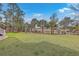Expansive backyard featuring lush landscaping, a playground, and a pergola, creating a perfect outdoor oasis at 2040 Ashburton Way, Mount Pleasant, SC 29466