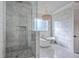 Bathroom featuring a walk-in shower, freestanding tub, chandelier, and bright window at 2040 Ashburton Way, Mount Pleasant, SC 29466